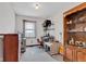Functional bedroom space with window, desk, and wood shelving, offering versatility and storage options at 4545 W 200 S, Lebanon, IN 46052