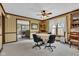 Inviting dining area with wood trim, a ceiling fan, and a view into the living room at 4545 W 200 S, Lebanon, IN 46052