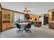 Open dining area features wood cabinetry, a ceiling fan, and a large window with natural light at 4545 W 200 S, Lebanon, IN 46052