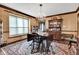 Elegant dining space showcasing a chandelier, vintage wallpaper, hardwood floors, and decor at 4545 W 200 S, Lebanon, IN 46052