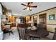 Warm and inviting dining area featuring wooden cabinetry and a unique ceiling fan at 4545 W 200 S, Lebanon, IN 46052