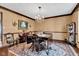 Charming dining room with chandelier, vintage wallpaper, hardwood trim and hardwood floors at 4545 W 200 S, Lebanon, IN 46052