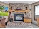 Inviting living room fireplace with a charming brick surround and a rustic wooden mantle at 4545 W 200 S, Lebanon, IN 46052