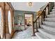 Inviting foyer featuring hardwood floors, staircase, and decorative front door at 4545 W 200 S, Lebanon, IN 46052