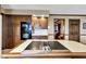 Traditional kitchen with wood cabinets, built-in oven and cooktop on the island at 4545 W 200 S, Lebanon, IN 46052