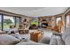 Inviting living room featuring a brick fireplace, large window with yard view, and comfortable seating at 4545 W 200 S, Lebanon, IN 46052