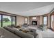 Spacious living room with a cozy fireplace and large windows offering a view of the outdoors at 4545 W 200 S, Lebanon, IN 46052