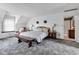 This main bedroom features plush carpet, a charming quilt, and great natural light at 4545 W 200 S, Lebanon, IN 46052