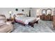 This main bedroom features an ensuite and a comfortable quilt at 4545 W 200 S, Lebanon, IN 46052