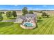 Overhead shot of a fenced in-ground pool with nearby patio seating, adjacent to a well-maintained home at 4545 W 200 S, Lebanon, IN 46052
