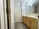Bathroom featuring dual sinks, and a large closet for ample storage and organization at 4767 Kelvington Dr, Indianapolis, IN 46254