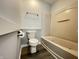 Well-maintained bathroom with bathtub, toilet, and towel bar at 4767 Kelvington Dr, Indianapolis, IN 46254