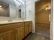 Bathroom with double sinks and mirrors that looks into bedroom at 4767 Kelvington Dr, Indianapolis, IN 46254