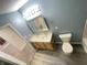 Bathroom featuring double sink vanity, framed mirror, and modern fixtures at 4767 Kelvington Dr, Indianapolis, IN 46254
