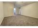 Spacious bedroom with neutral carpet, ceiling fan, and en-suite bathroom at 4767 Kelvington Dr, Indianapolis, IN 46254