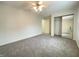 Spacious bedroom featuring neutral carpet and a large closet at 4767 Kelvington Dr, Indianapolis, IN 46254