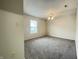 Cozy bedroom with neutral paint and carpet, complemented by a bright window at 4767 Kelvington Dr, Indianapolis, IN 46254
