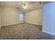 Bright bedroom boasts vaulted ceiling, neutral carpet, and a window for natural light at 4767 Kelvington Dr, Indianapolis, IN 46254