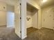 A walk-in closet with vinyl flooring, shelving, and washer/dryer hookups for convenience at 4767 Kelvington Dr, Indianapolis, IN 46254