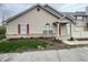 Charming townhouse featuring vinyl siding, red shutters, and brick foundation at 4767 Kelvington Dr, Indianapolis, IN 46254