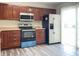 Modern kitchen with stainless steel appliances, and wood cabinets at 4767 Kelvington Dr, Indianapolis, IN 46254