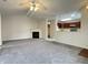 Spacious living room with fireplace and open view to the kitchen at 4767 Kelvington Dr, Indianapolis, IN 46254