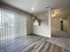 Bright living area with wood-look flooring, large window, and an open layout at 4767 Kelvington Dr, Indianapolis, IN 46254