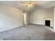 Bright living room with vaulted ceiling, fireplace, and neutral carpet at 4767 Kelvington Dr, Indianapolis, IN 46254