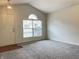 Inviting living room with vaulted ceiling and ample natural light at 4767 Kelvington Dr, Indianapolis, IN 46254