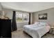 Cozy bedroom featuring a neutral color palette and a large window providing ample natural light at 5311 Larita Ln, Anderson, IN 46017
