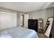 Comfortable bedroom showcasing neutral walls, carpet and decor plus closet and ensuite access at 5311 Larita Ln, Anderson, IN 46017
