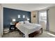 Bedroom featuring a queen bed with striped bedding, complemented by bedside tables and lamps at 5311 Larita Ln, Anderson, IN 46017