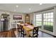 Inviting dining room with natural light, wooden table, and comfortable seating at 5311 Larita Ln, Anderson, IN 46017