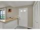 Inviting entryway features a wooden countertop on a painted brick base, adding rustic charm at 5311 Larita Ln, Anderson, IN 46017
