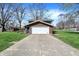 Detached two-car garage featuring a concrete driveway and well-maintained lawn, perfect for parking at 5311 Larita Ln, Anderson, IN 46017