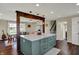 Stylish kitchen island with a quartz countertop and pendant lighting, enhancing the space at 5311 Larita Ln, Anderson, IN 46017