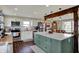 Well-equipped kitchen with stainless steel appliances and a large island, ideal for cooking and socializing at 5311 Larita Ln, Anderson, IN 46017