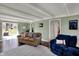 Bright living room with wood floors, fireplace, sliders and multiple windows at 5311 Larita Ln, Anderson, IN 46017