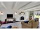 Comfortable living room with brick fireplace, wood floors, and sliders to back yard at 5311 Larita Ln, Anderson, IN 46017