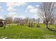 Expansive backyard featuring a lawn and trees, perfect for outdoor activities and enjoying nature at 5357 Collett E Dr, Camby, IN 46113