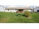 Expansive backyard featuring a well-maintained lawn and a covered porch, perfect for outdoor entertaining and relaxation at 5357 Collett E Dr, Camby, IN 46113