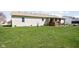 Spacious backyard featuring a lush lawn and a covered porch, ideal for outdoor activities and relaxation at 5357 Collett E Dr, Camby, IN 46113