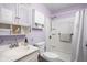 Bright bathroom featuring a shower, built in storage cabinets, and modern fixtures for a clean and functional space at 5357 Collett E Dr, Camby, IN 46113