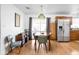 Charming dining area with a wooden table, modern chairs, and a stainless steel refrigerator at 5357 Collett E Dr, Camby, IN 46113