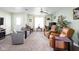 Comfortable living room featuring carpet floors, light green walls, and large windows with natural light at 5357 Collett E Dr, Camby, IN 46113