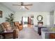 Inviting living room with cozy seating, light green walls, and an open view to the dining area at 5357 Collett E Dr, Camby, IN 46113