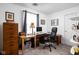 Functional office space with a large desk, ample storage, and a comfortable chair, ideal for remote work at 5357 Collett E Dr, Camby, IN 46113