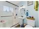 Updated bathroom featuring a shower and tub combination and stylish sink and fixtures at 5427 E 19Th St, Indianapolis, IN 46218