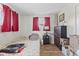 Cozy bedroom with a bed, dark-wood dresser and hardwood floors at 5427 E 19Th St, Indianapolis, IN 46218