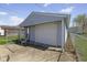 Garage featuring a white garage door and vinyl siding, with a fenced-in yard at 5427 E 19Th St, Indianapolis, IN 46218